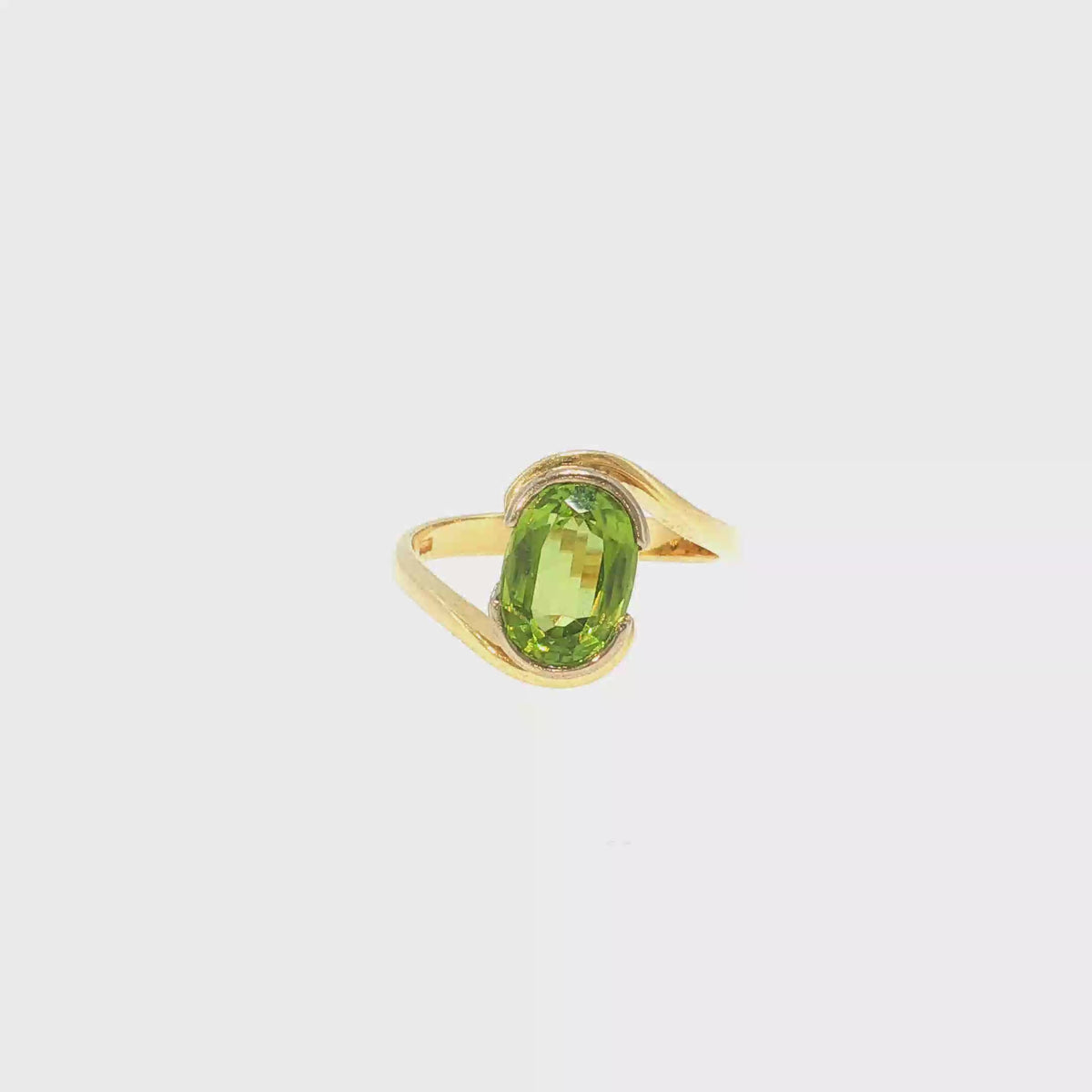 18kt Gelbgold Solitärring mit ca. 4ct Peridot im Bypass-Design